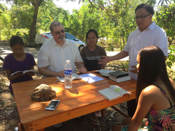 mother and niece  being baptised in South China Sea